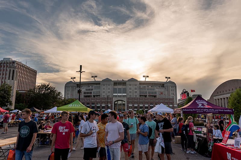 Students at an event outside Memorial Stadium