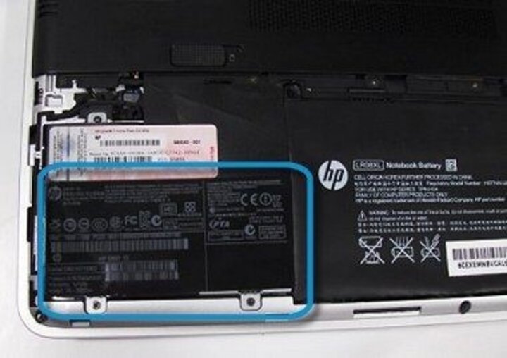 Serial number located inside of laptop battery compartment