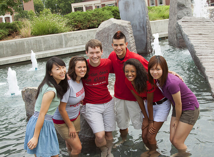 Six students standing in Broyhill Fountain.